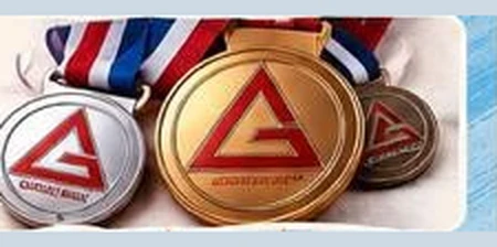 Medals from the Gracie Barra Coppell in-house tournament flyer