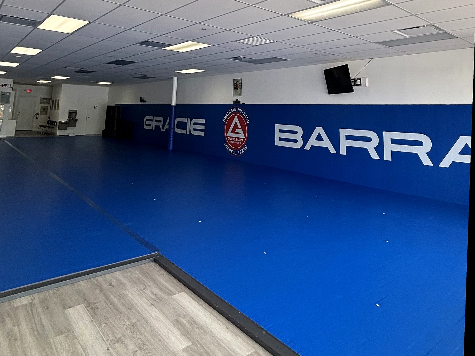 Training mats and Gracie Barra wall inside Gracie Barra Coppell