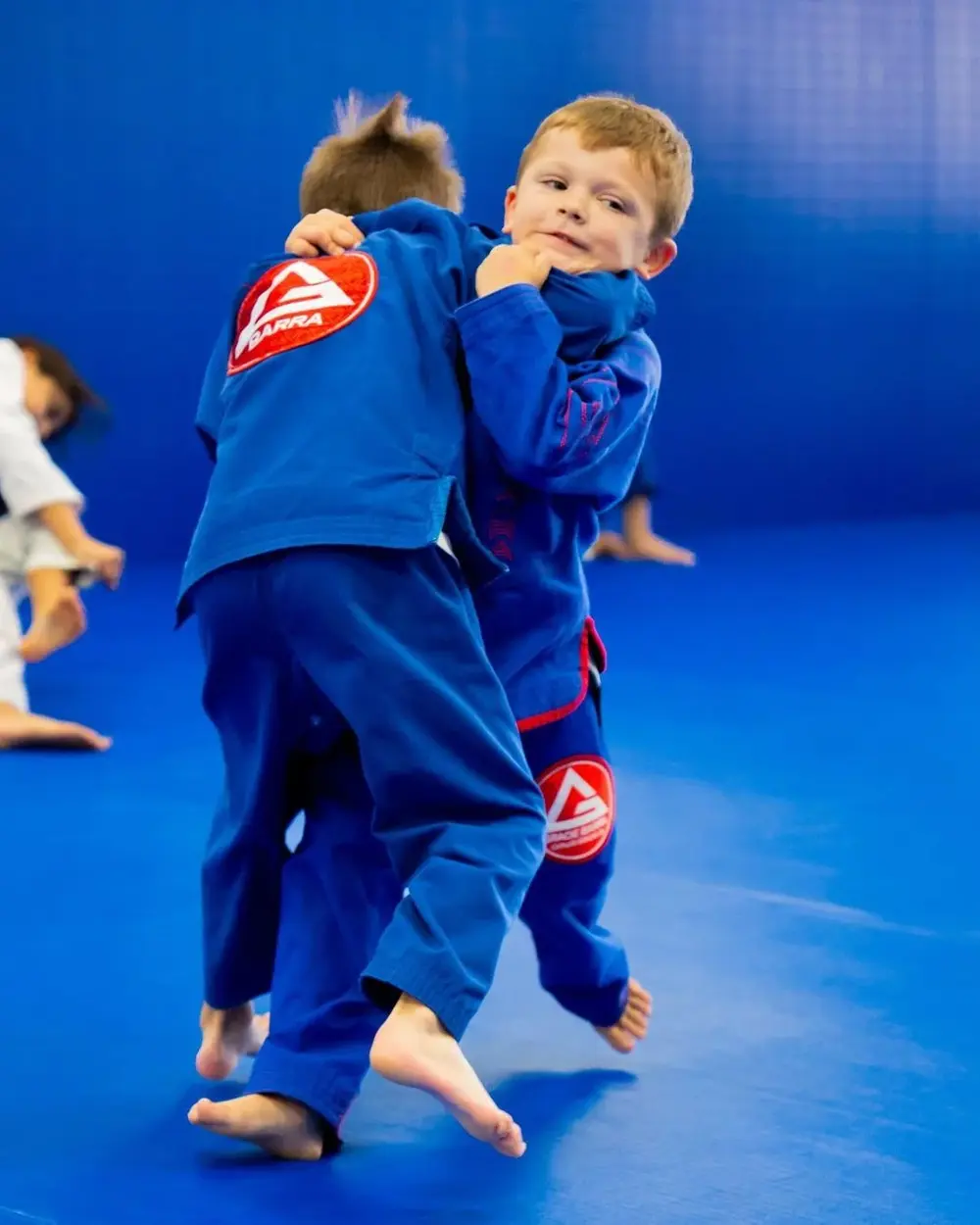 Coach with kids on the mat at Gracie Barra Coppell