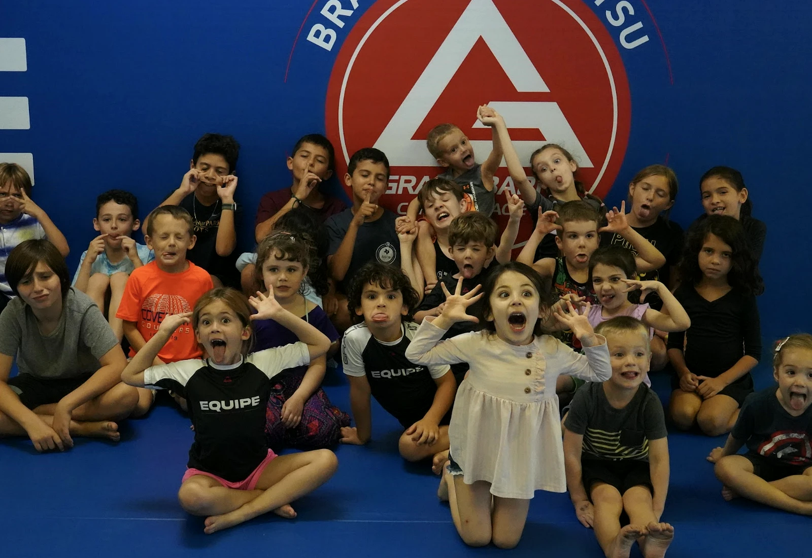 Kids having fun together on the mats at Gracie Barra Coppell